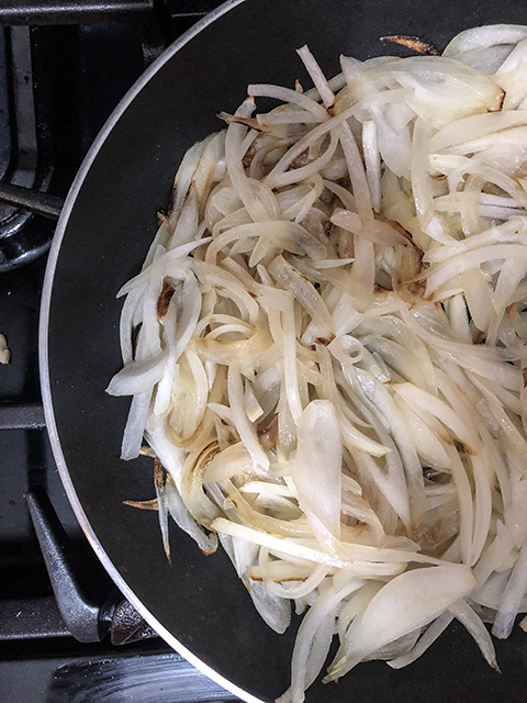 sliced onions cooking